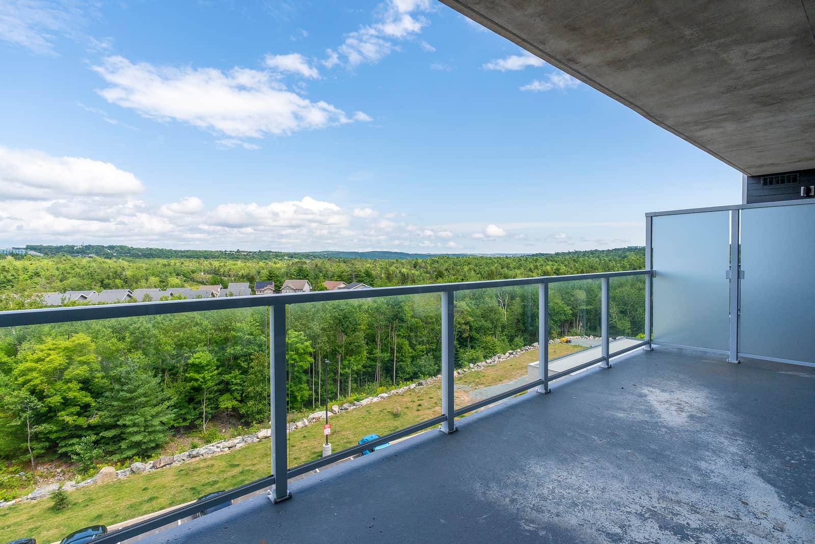 Private balcony with a treed view