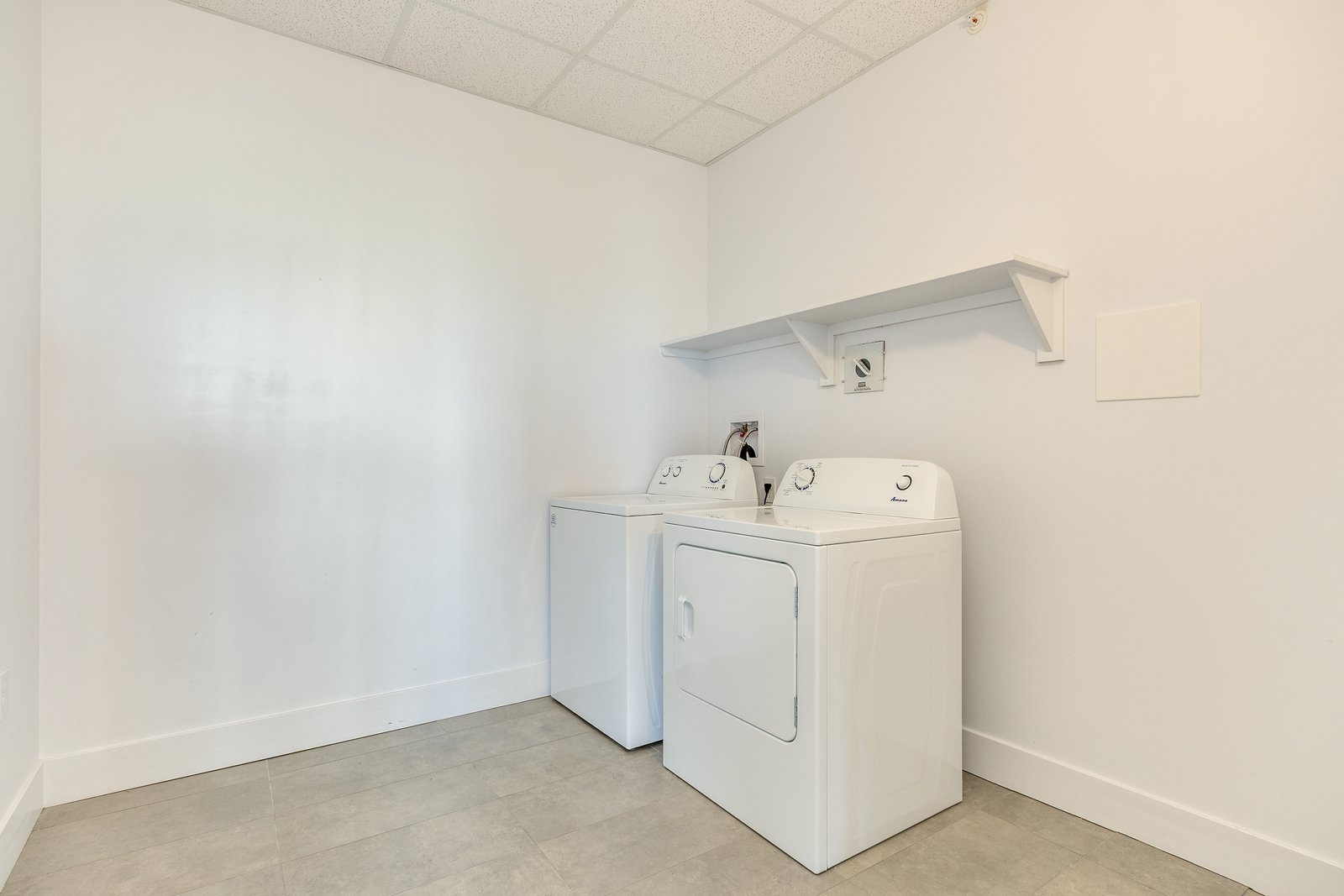 In-suite laundry room with washer and dryer